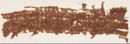 Textile fragment with ornate squares and flower-headsfront