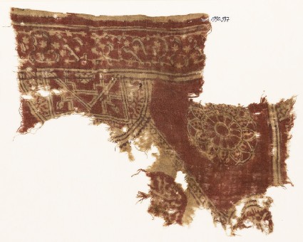 Textile fragment with semicircle, complex rosette, and circle fragment with scriptfront