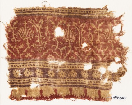 Textile fragment with stylized plants, half-medallions, rosettes, and crenellationsfront