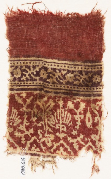 Textile fragment with stylized plants, half-medallions, and crossed tendrilsfront