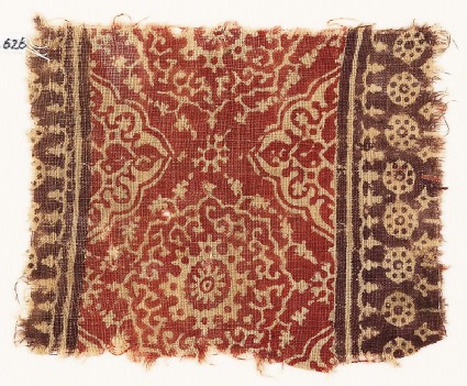 Textile fragment with ornate flower-heads, medallions, and dotted circlesfront