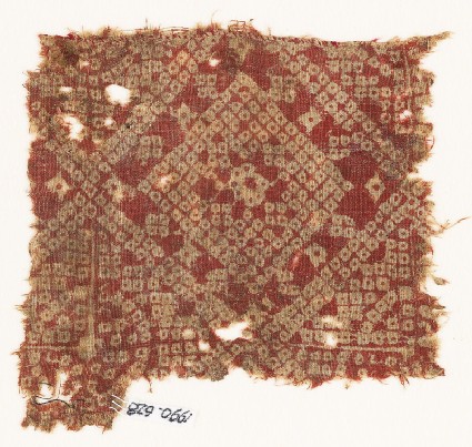 Textile fragment imitating bandhani, or tie-dye, with squaresfront