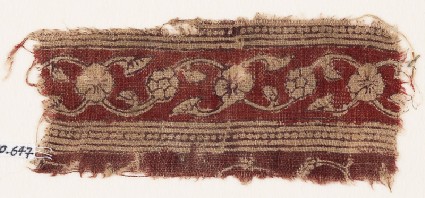Textile fragment with vine, flowers, leaves, and lotus blossomsfront