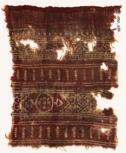 Textile fragment with bands of arches, a vine, a circle, and polesfront