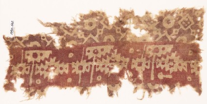 Textile fragment with serrated shapes, rosettes, and squaresfront