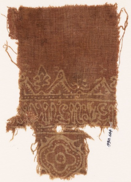 Textile fragment with medallion and reversed scriptfront