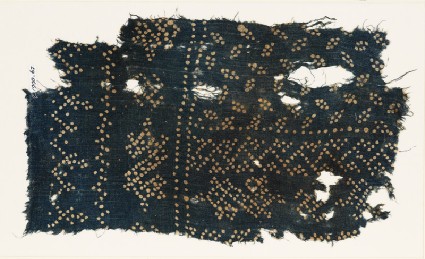 Textile fragment with dots arranged in bands and ovalsfront