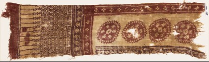 Textile fragment with large circles, flowers, and hexagonsfront