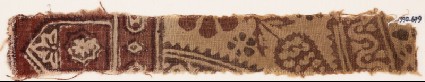 Textile fragment with floral design, small cartouches, and a tab-shapefront