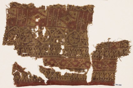 Textile fragment with circles, crossed tendrils, dotted tendrils, and stepped diamond-shapesfront