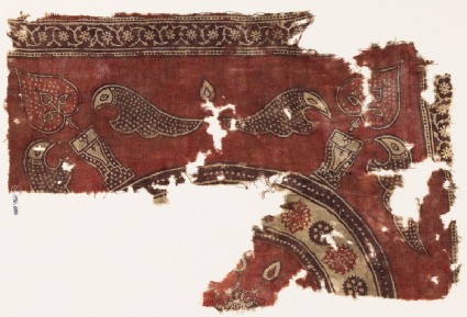 Textile fragment with stylized plants in pots, and a large circular designfront