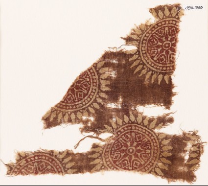 Textile fragment with rosettes and stars in dotted circlesfront
