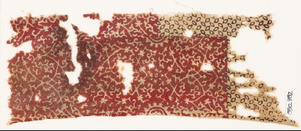 Textile fragment with oval medallions and petals or grainsfront