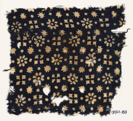 Textile fragment with rosettes, dots, floral shapes, and squaresfront