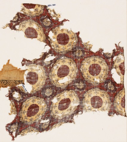 Textile fragment with linked circles and interlacefront