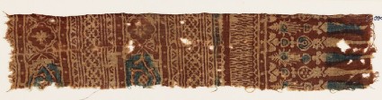 Textile fragment with bands of medallions, quatrefoils, and stylized plantsfront