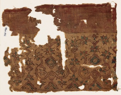 Textile fragment possibly imitating patola pattern, with stylized plantsfront