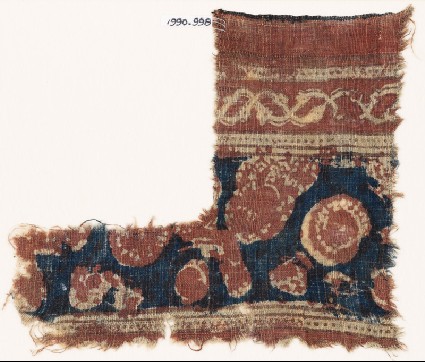 Textile fragment with floral shapesfront