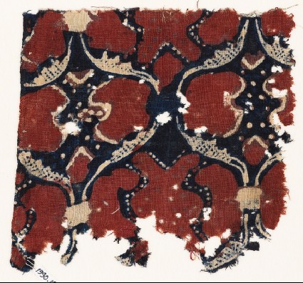 Textile fragment with linked oval medallionsfront