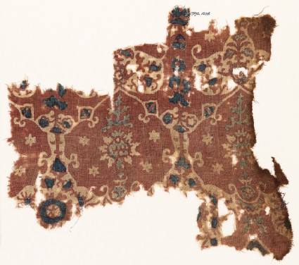 Textile fragment with lobed shapes, possibly leavesfront