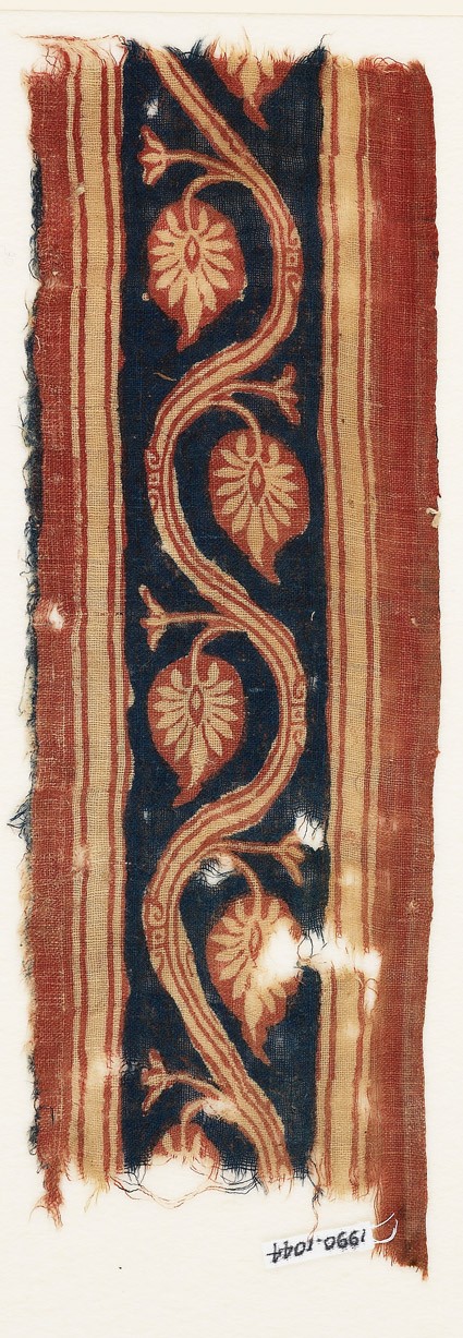 Textile fragment with vine and palmette leavesfront