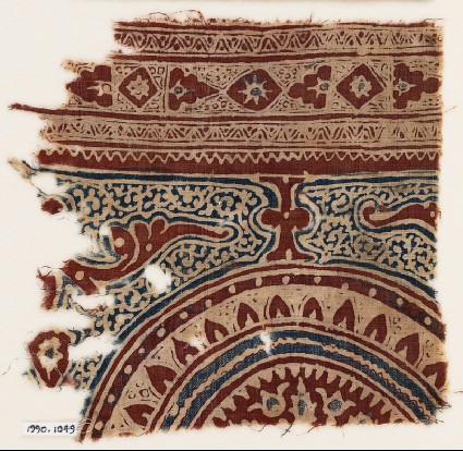 Textile fragment with part of a circle, petals, and tendrilsfront