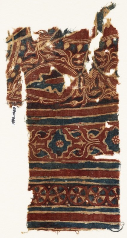 Textile fragment with leaves, a stepped square, and wheelsfront