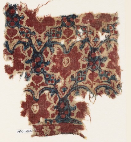 Textile fragment with interlacing tendrils, leaves, and flowersfront