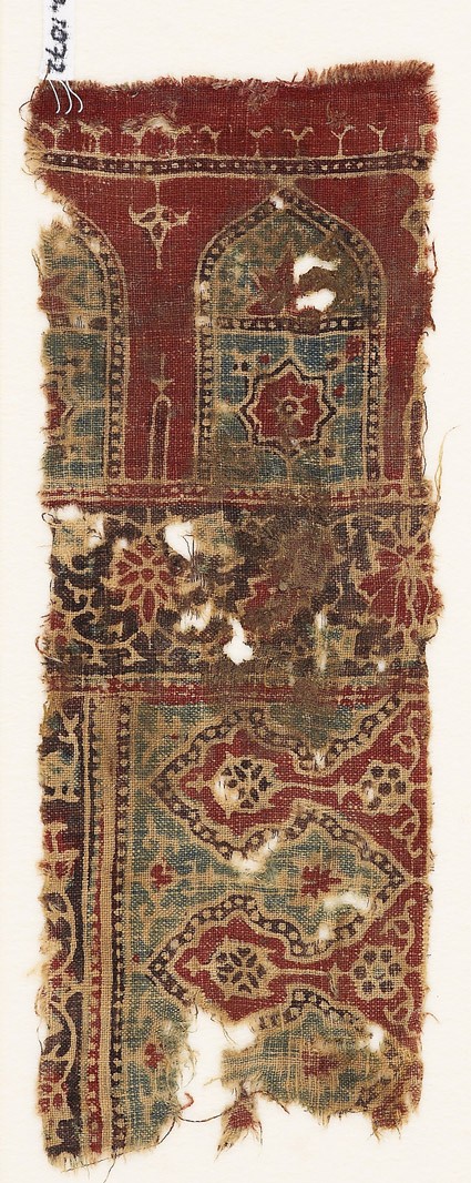 Textile fragment with arches and stylized plantsfront