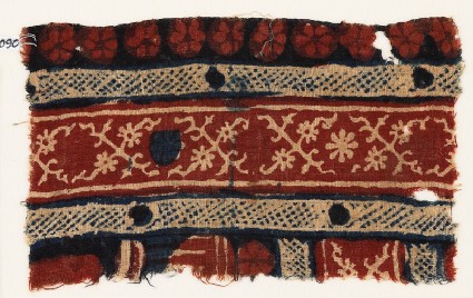Textile fragment with crossed tendrils and rosettesfront