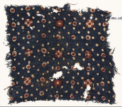 Textile fragment with dots and rosettesfront