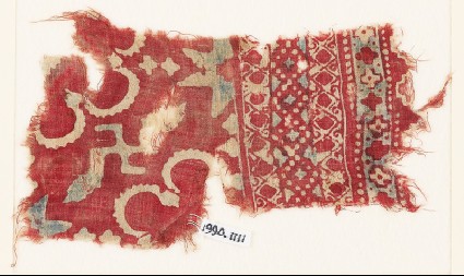 Textile fragment with stars, swastika, and possibly rosettesfront