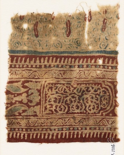 Textile fragment with stylized plants, a cartouche, and interlacefront