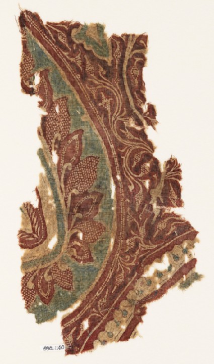 Textile fragment with part of a large leaf, tendrils, and bunches of fruitfront