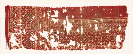 Textile fragment with linked rosettes, squares, and diamond-shapesfront