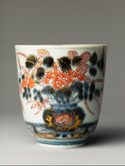 Cup with flowers on a terraceside