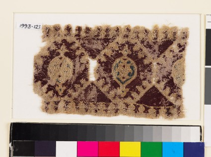 Textile fragment with linked octagons and medallionsfront
