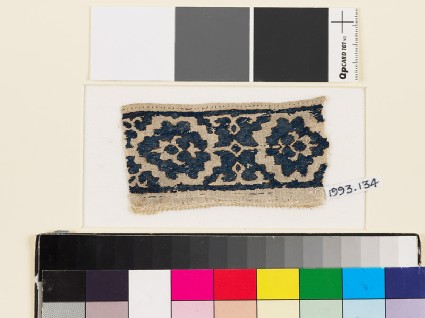 Textile fragment with paired palmettes and octagonsfront