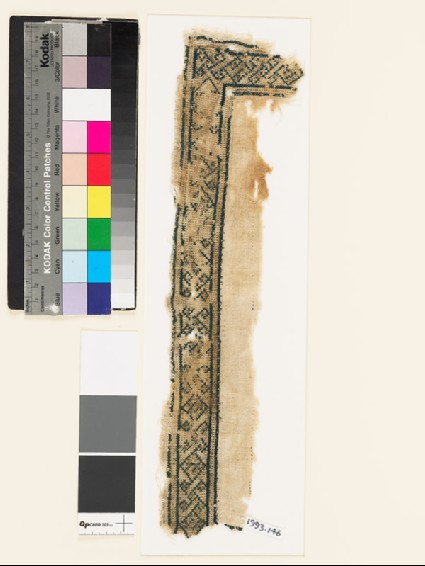 Textile fragment with geometric shapes, diamond-shapes, and crossesfront