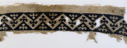 Textile fragment with band of chevrons and trefoil finialsfront