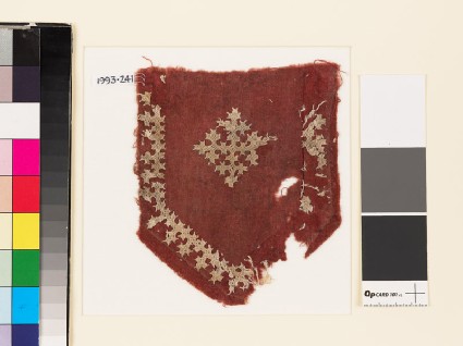Textile fragment from a tab with a cross, shield-shape, and linked crossesfront