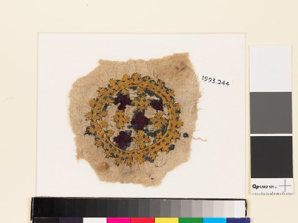 Roundel textile fragment with crosses and linked crossesfront