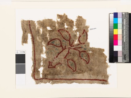 Textile fragment with plant and leavesfront