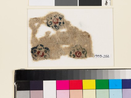 Textile fragment with lobed rosettes, rhomboids, and tendrilsfront