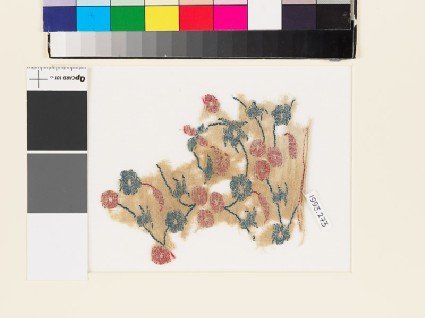 Textile fragment with circular flowers, leaves, and budsfront