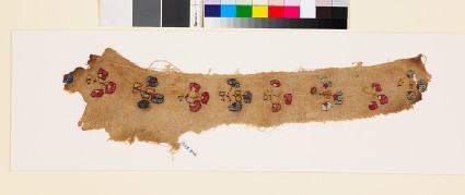 Textile fragment with stylized floral shapesfront