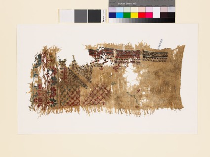 Sampler fragment with lattice, stars, and geometric and floral shapesfront