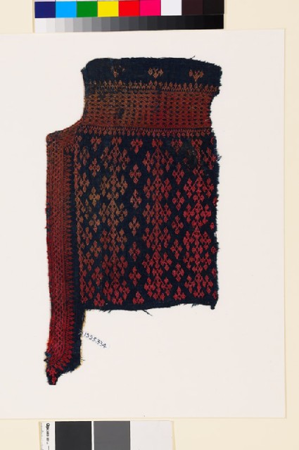 Textile fragment from the neck of a garment with linked diamond-shapes and latticefront