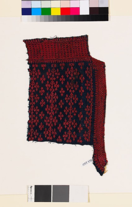 Textile fragment from the neck of a garment with linked diamond-shapes and latticefront