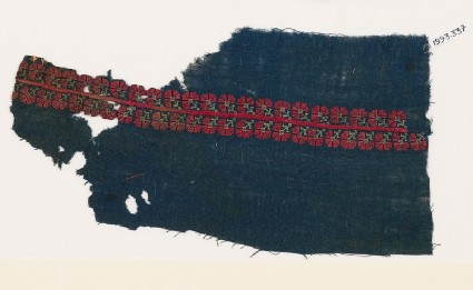 Textile fragment from a garment with band of stylized flowersfront